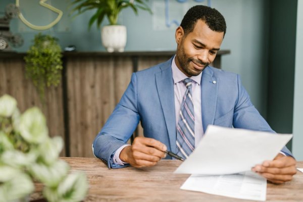 man looking at paper